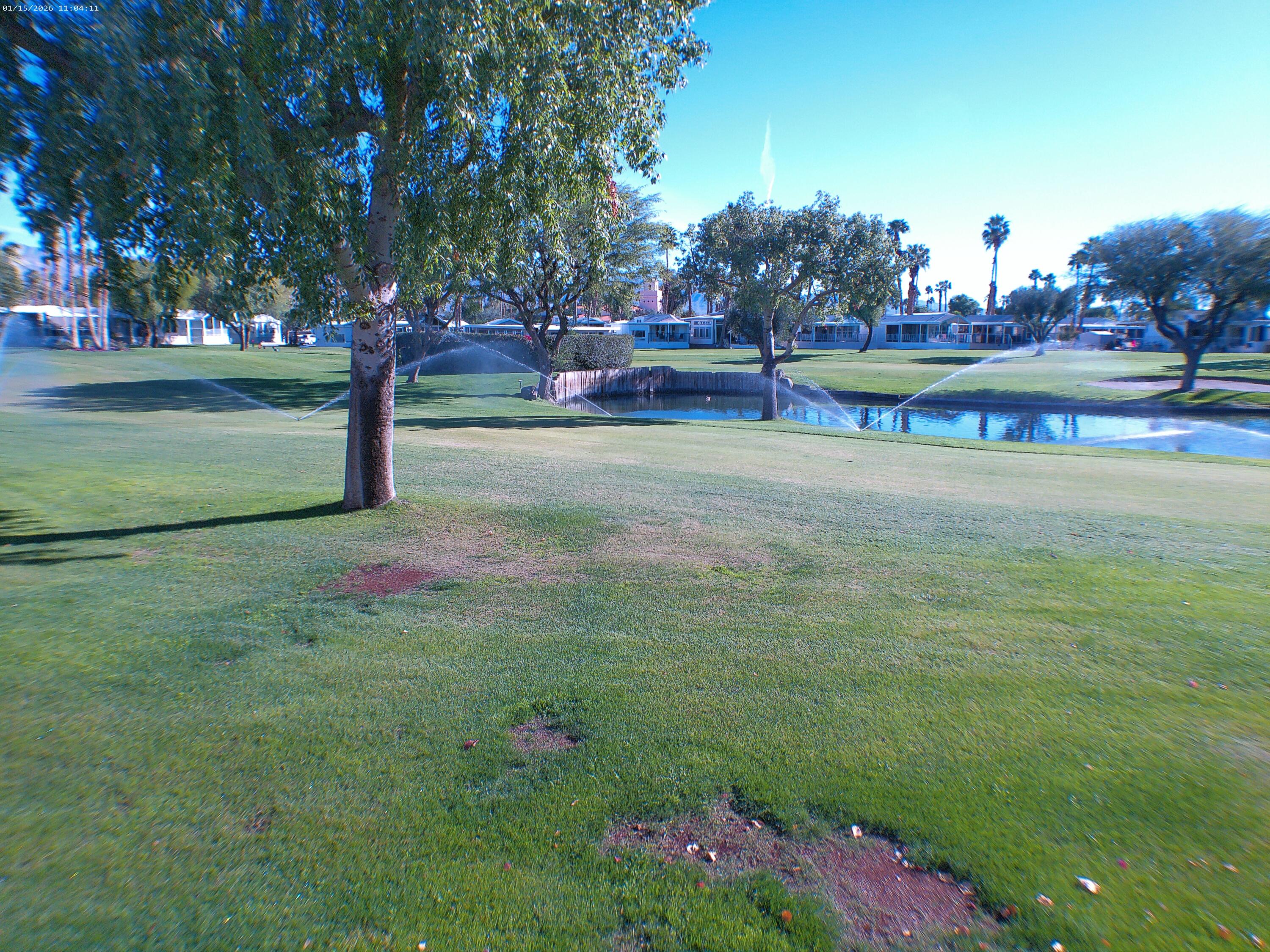 84136 Ave 44, Unit 337 Indio, CA 92203 - Photo 9 of 31 a view of a fountain in front of a house