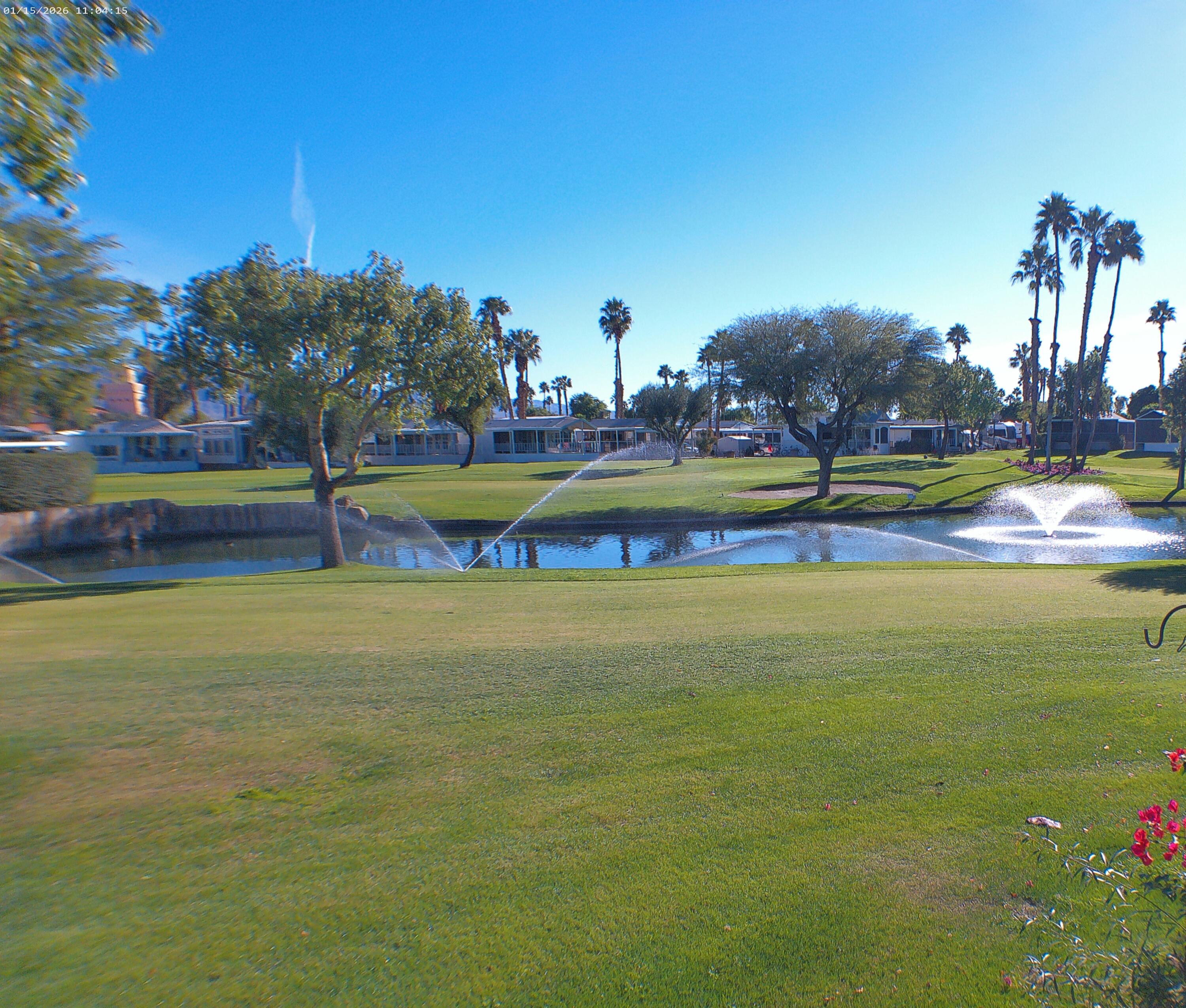 84136 Ave 44, Unit 337 Indio, CA 92203 - Photo 10 of 31 a view of a swimming pool with an outdoor space and seating area