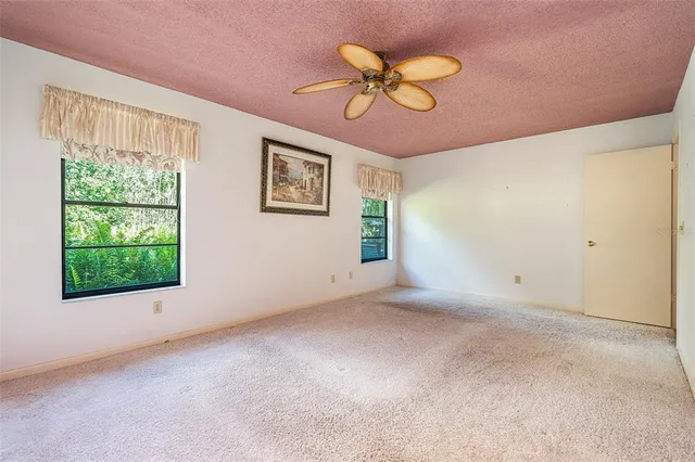 a bed room with a bed and a chandelier
