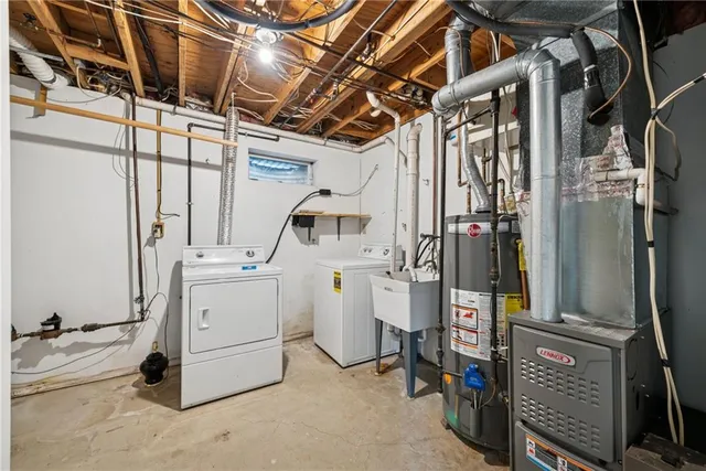 a white toilet sitting next to a bathroom sink