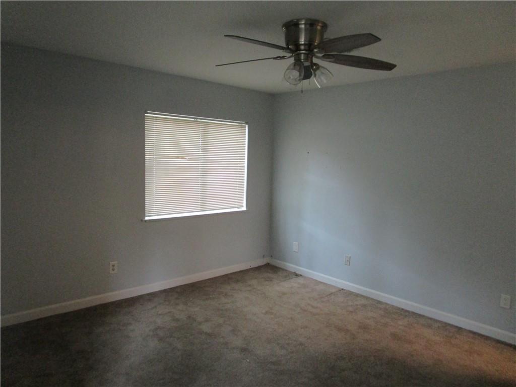 4003 Wingate Way Sandy Springs, GA 30350 - Photo 22 of 29 an empty room with a window and a fan