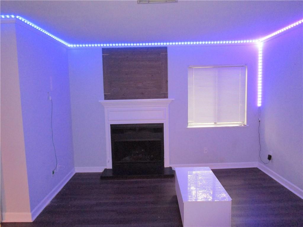 4003 Wingate Way Sandy Springs, GA 30350 - Photo 24 of 29 a view of a livingroom with wooden floor and a fireplace