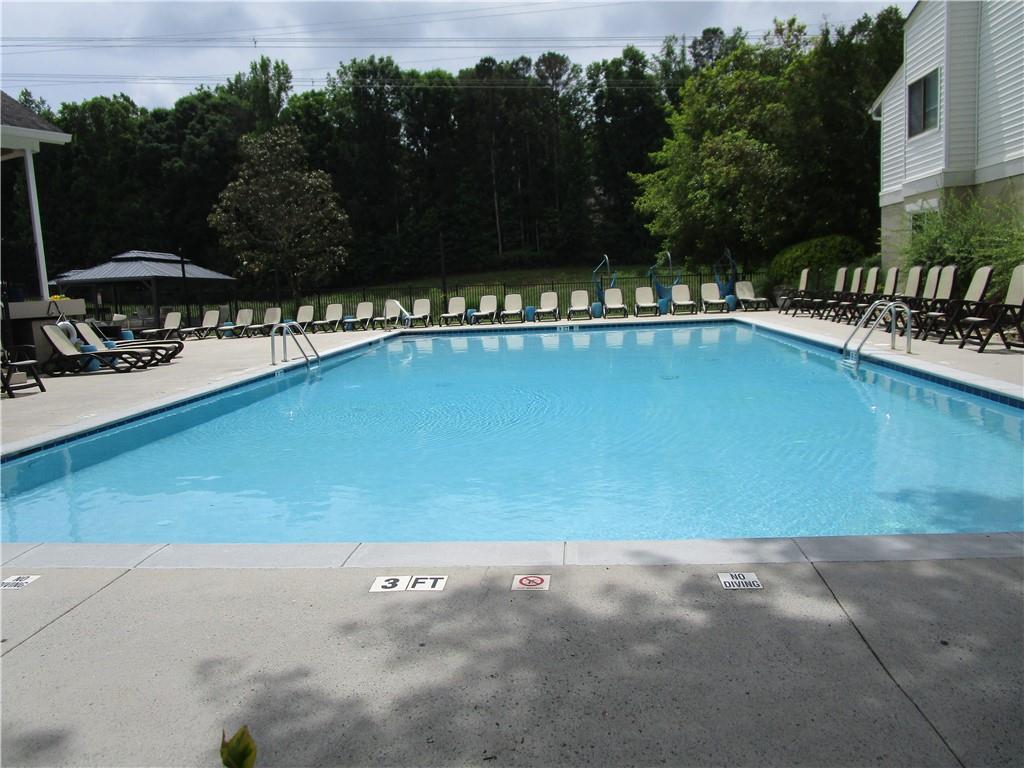 4003 Wingate Way Sandy Springs, GA 30350 - Photo 28 of 29 a view of a swimming pool and lounge chair