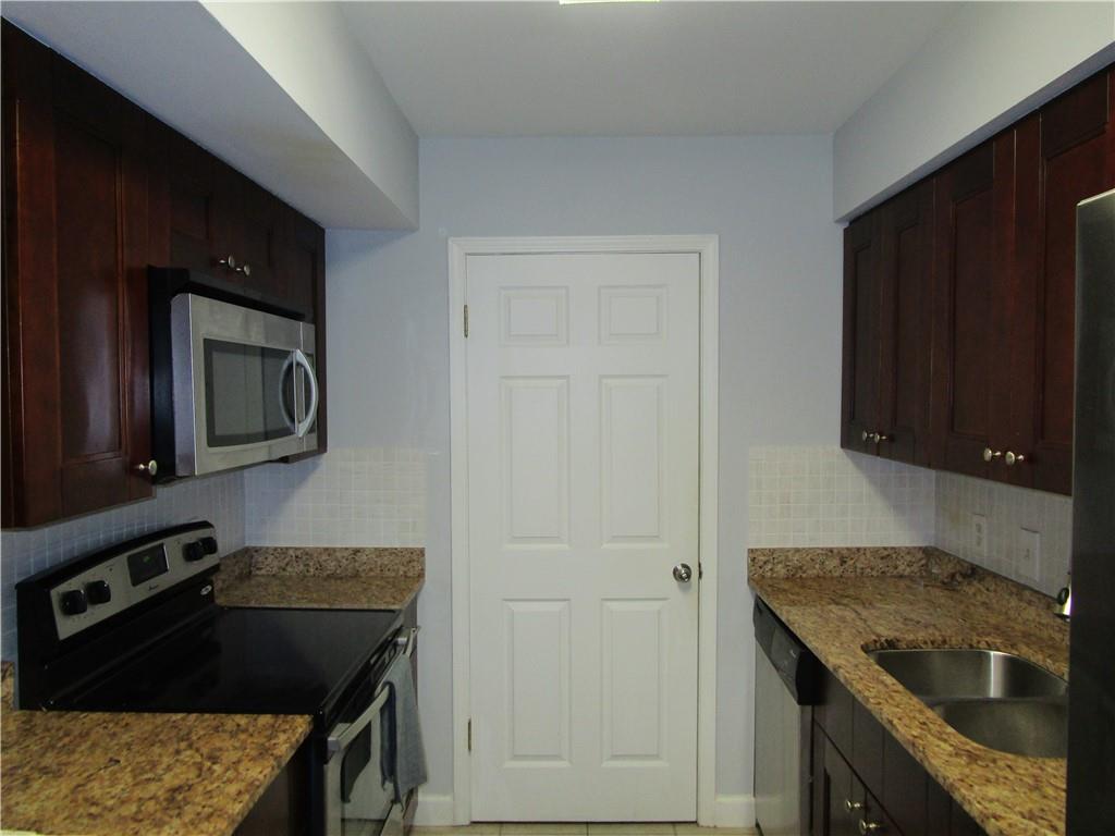4003 Wingate Way Sandy Springs, GA 30350 - Photo 9 of 29 a kitchen that has a sink and a stove in it