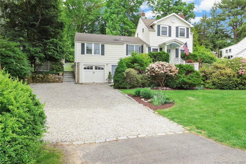 129 Compo Road North Westport, CT 06880 - Photo 1 of 1 a front view of house with yard and green space