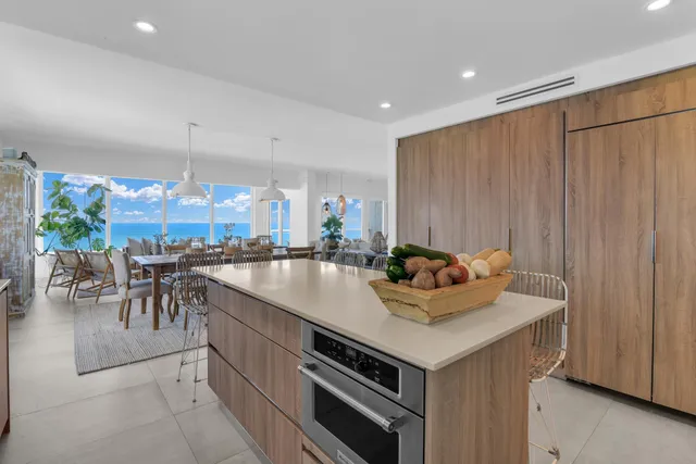 a kitchen with a table chairs stove and microwave