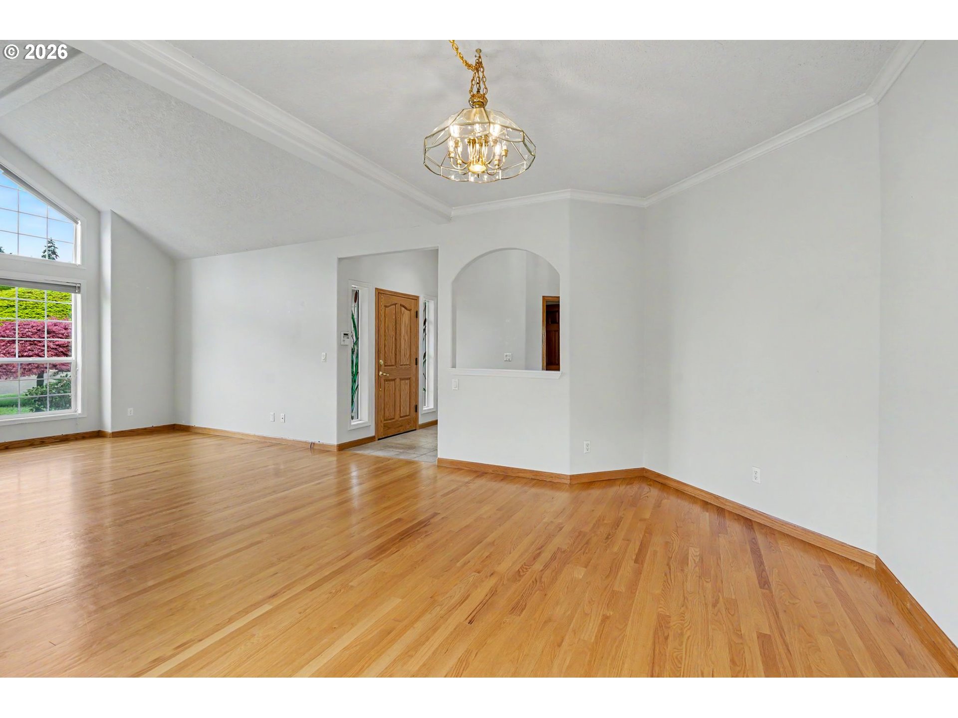 1470 Ranier Loop Northwest Salem, OR 97304 - Photo 13 of 48 a view of an empty room with window and wooden floor