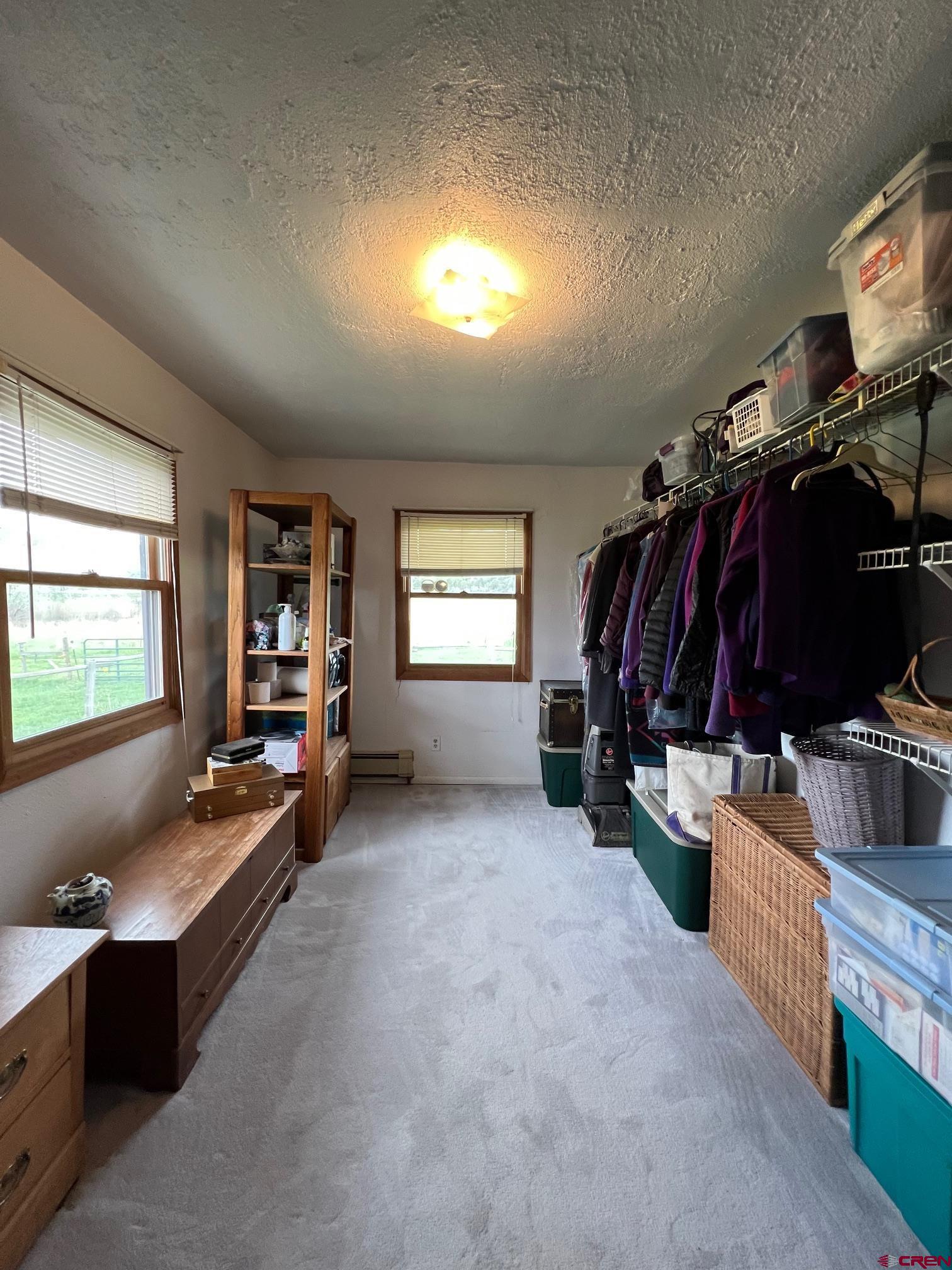 21446 Uncompahgre Road Montrose, CO 81403 - Photo 17 of 40 a view of a room with furniture and a window