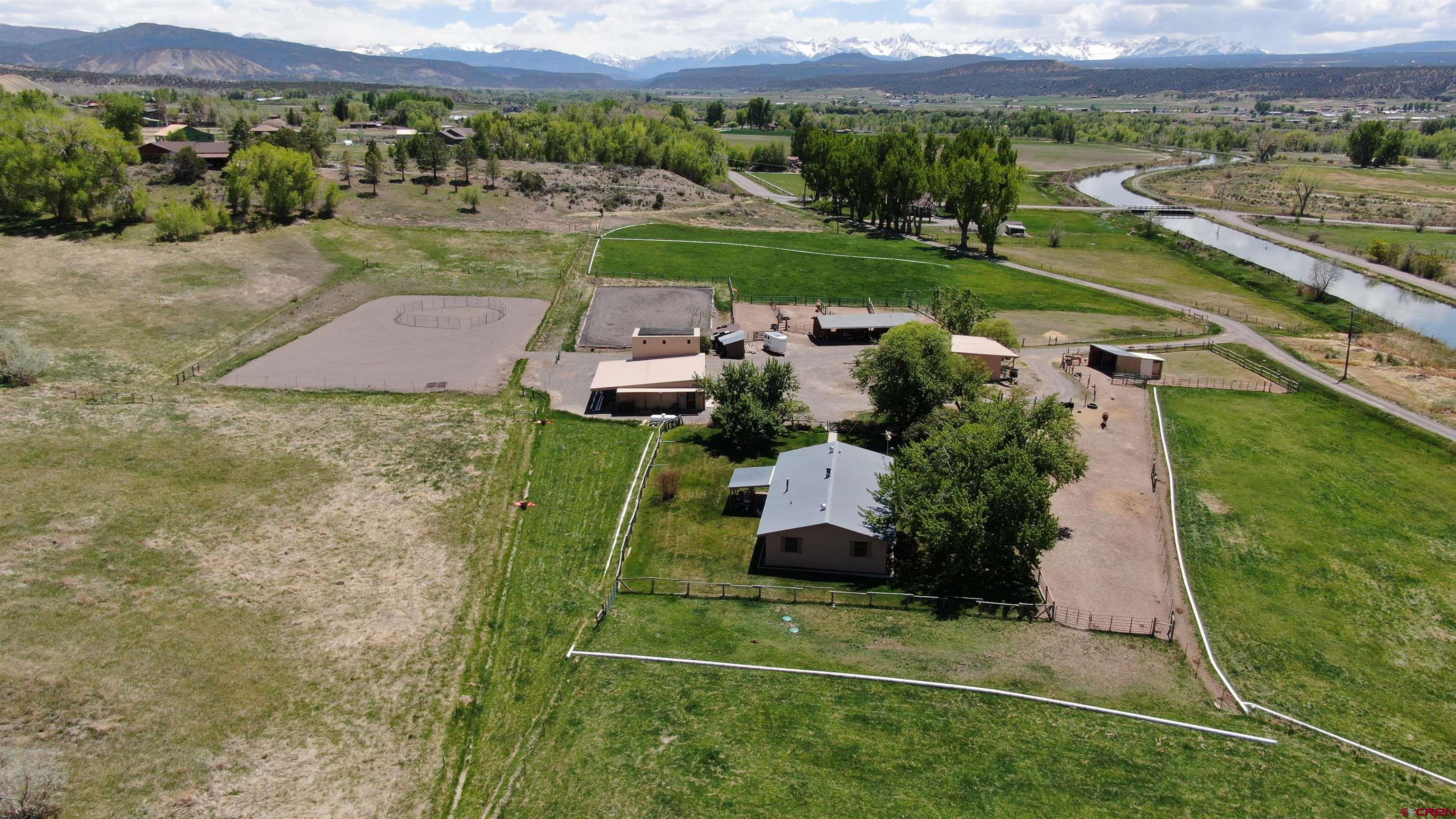 21446 Uncompahgre Road Montrose, CO 81403 - Photo 2 of 40 an aerial view of a house with a garden