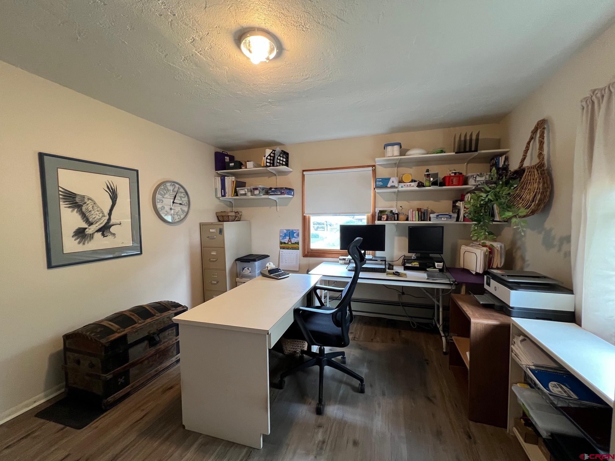 21446 Uncompahgre Road Montrose, CO 81403 - Photo 21 of 40 a workspace with furniture and wooden floor