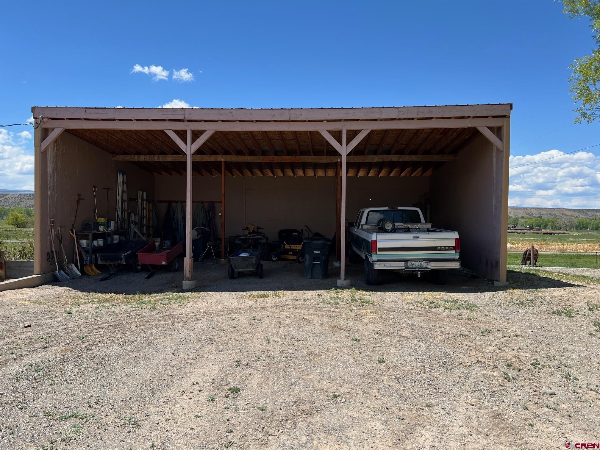 21446 Uncompahgre Road Montrose, CO 81403 - Photo 27 of 40 an outdoor view of a garage