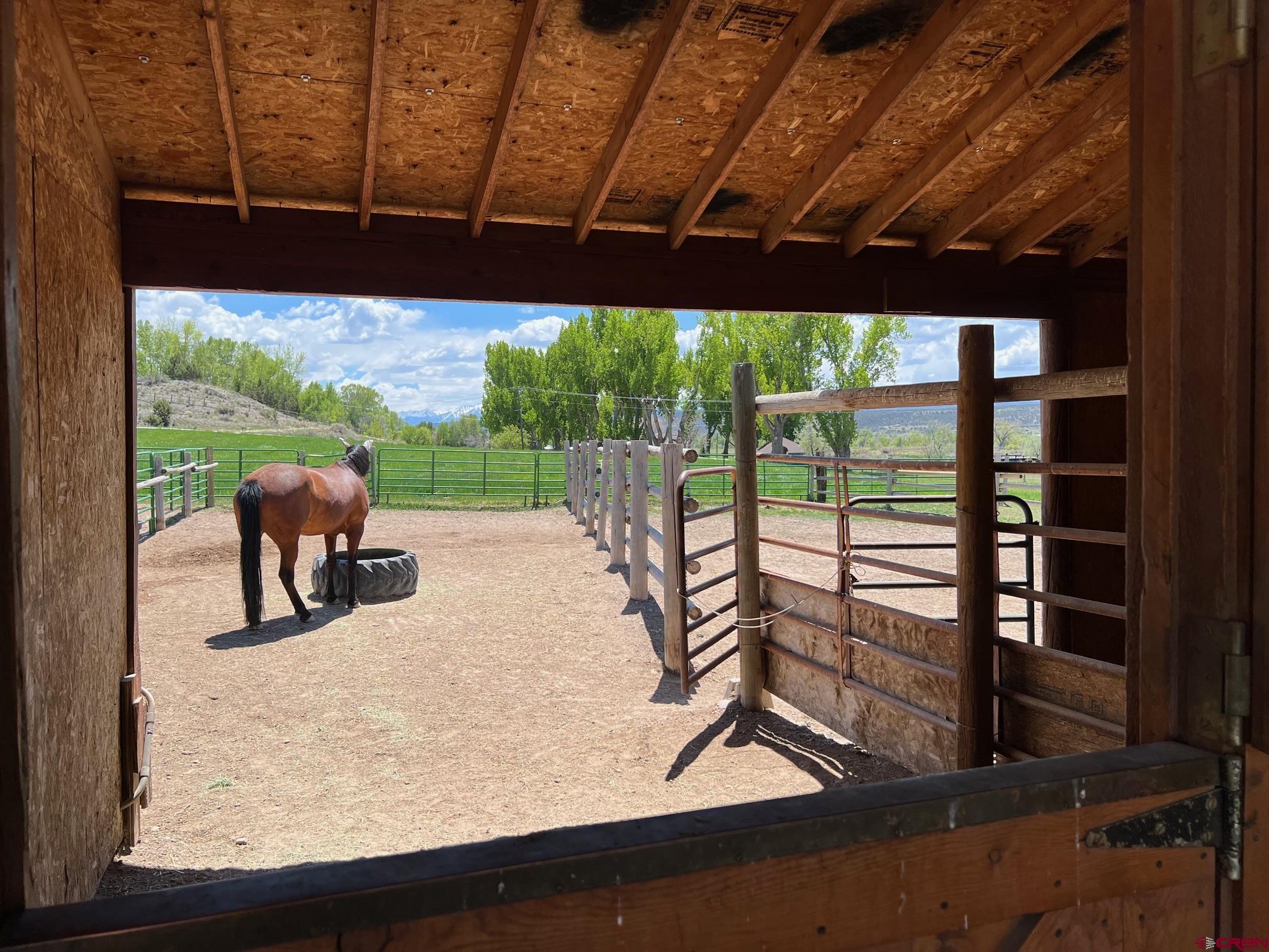 21446 Uncompahgre Road Montrose, CO 81403 - Photo 29 of 40 a view of a chairs and table in the patio