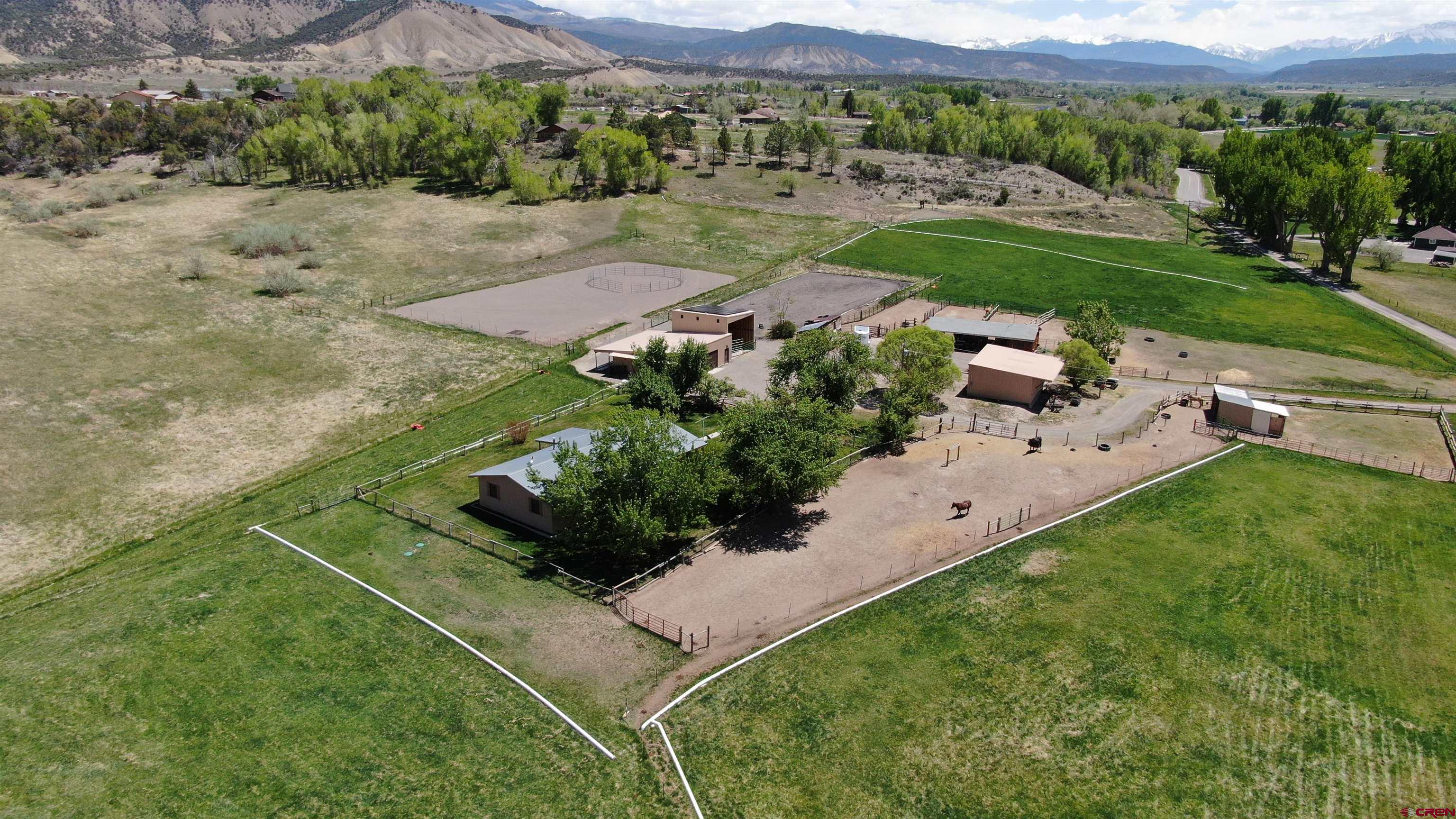 21446 Uncompahgre Road Montrose, CO 81403 - Photo 3 of 40 an aerial view of a house with a yard