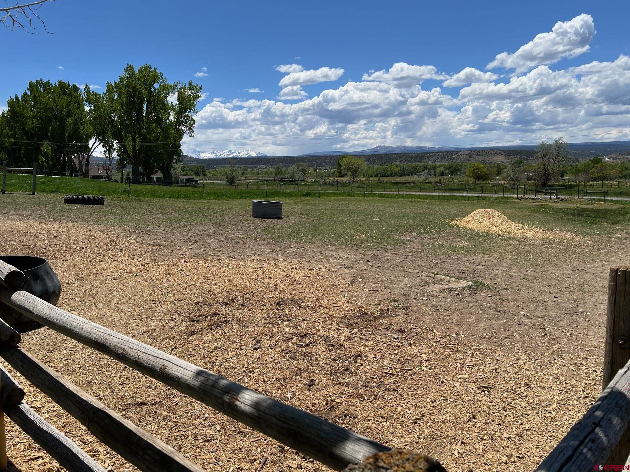 21446 Uncompahgre Road Montrose, CO 81403 - Photo 34 of 40 a view of a lake with a yard