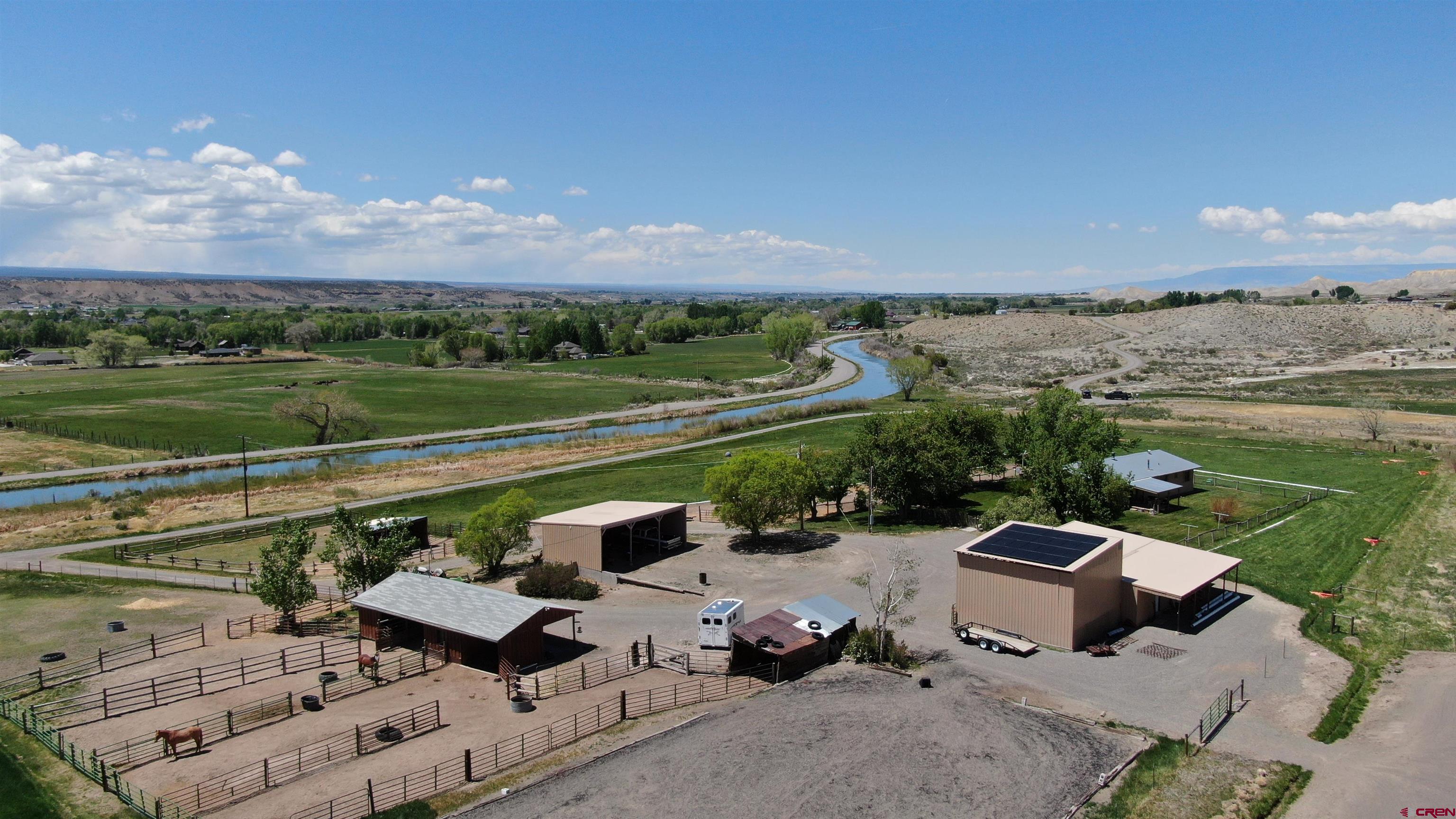 21446 Uncompahgre Road Montrose, CO 81403 - Photo 8 of 40 a view of a terrace with lawn chairs