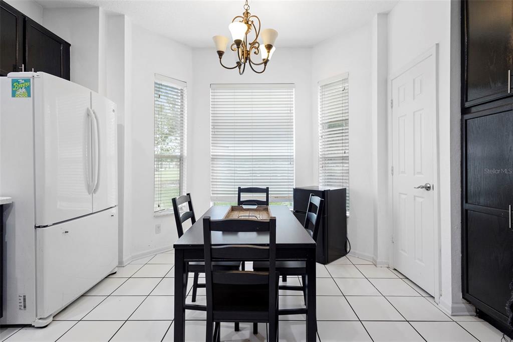3111 River Branch Circle Kissimmee, FL 34741 - Photo 18 of 39 a dining room with furniture and window