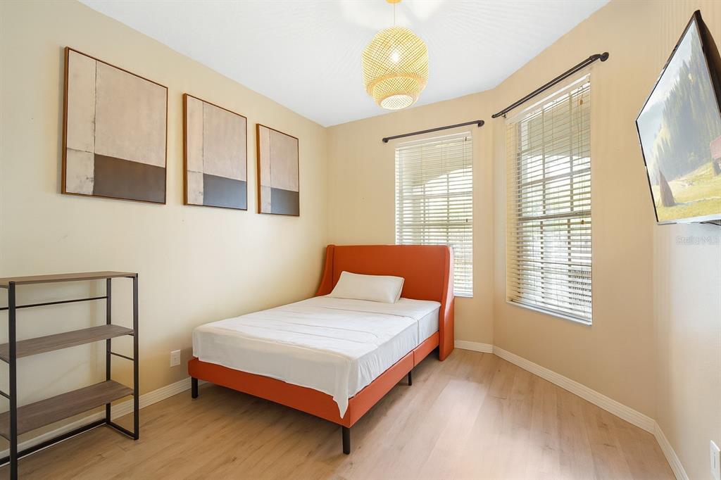 3111 River Branch Circle Kissimmee, FL 34741 - Photo 23 of 39 a bedroom with a bed and a window