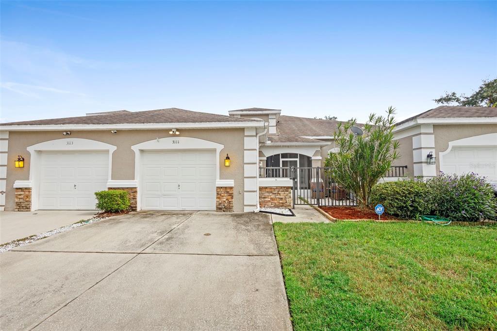 3111 River Branch Circle Kissimmee, FL 34741 - Photo 30 of 39 front view of a house with a yard