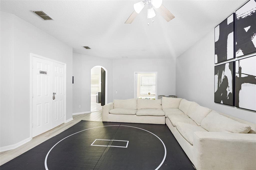 3111 River Branch Circle Kissimmee, FL 34741 - Photo 7 of 39 a view of living room with furniture and a fireplace