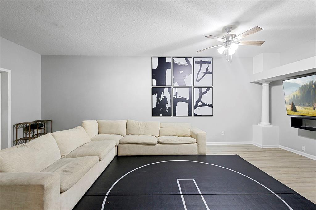 3111 River Branch Circle Kissimmee, FL 34741 - Photo 8 of 39 a living room with furniture and a flat screen tv