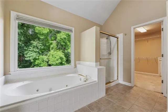 a bathroom with a bathtub and a shower