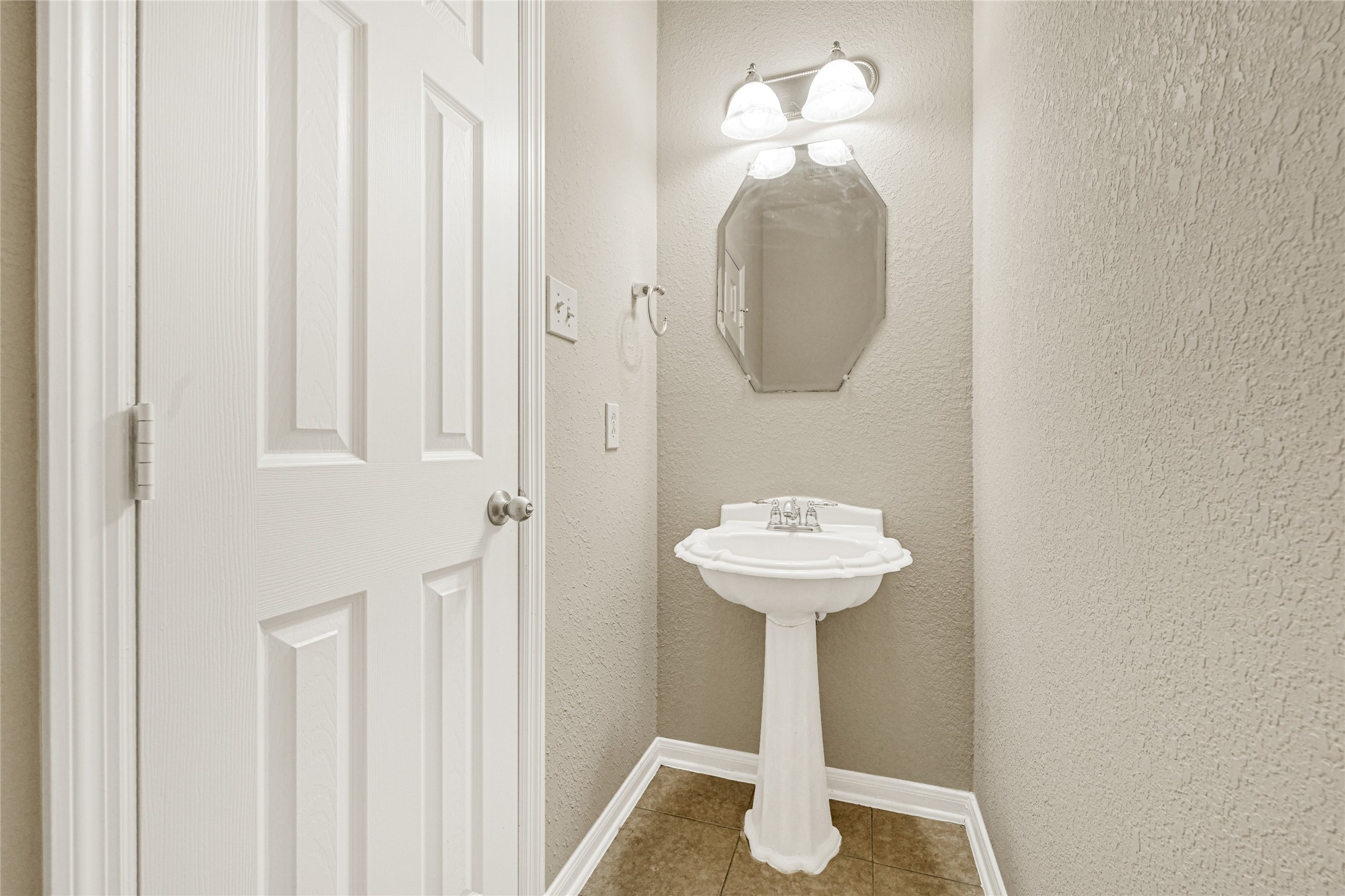 16415 Lapis River Drive Spring, TX 77379 - Photo 12 of 20 a bathroom with a sink and a mirror