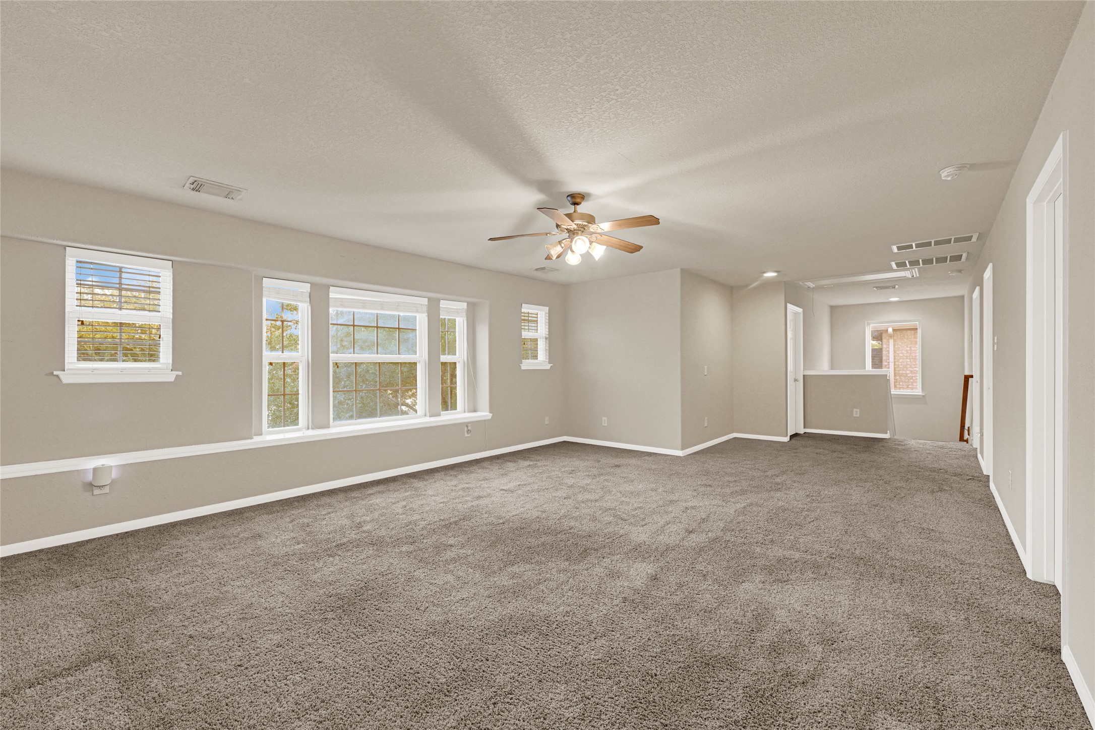 16415 Lapis River Drive Spring, TX 77379 - Photo 13 of 20 a view of an empty room with a window