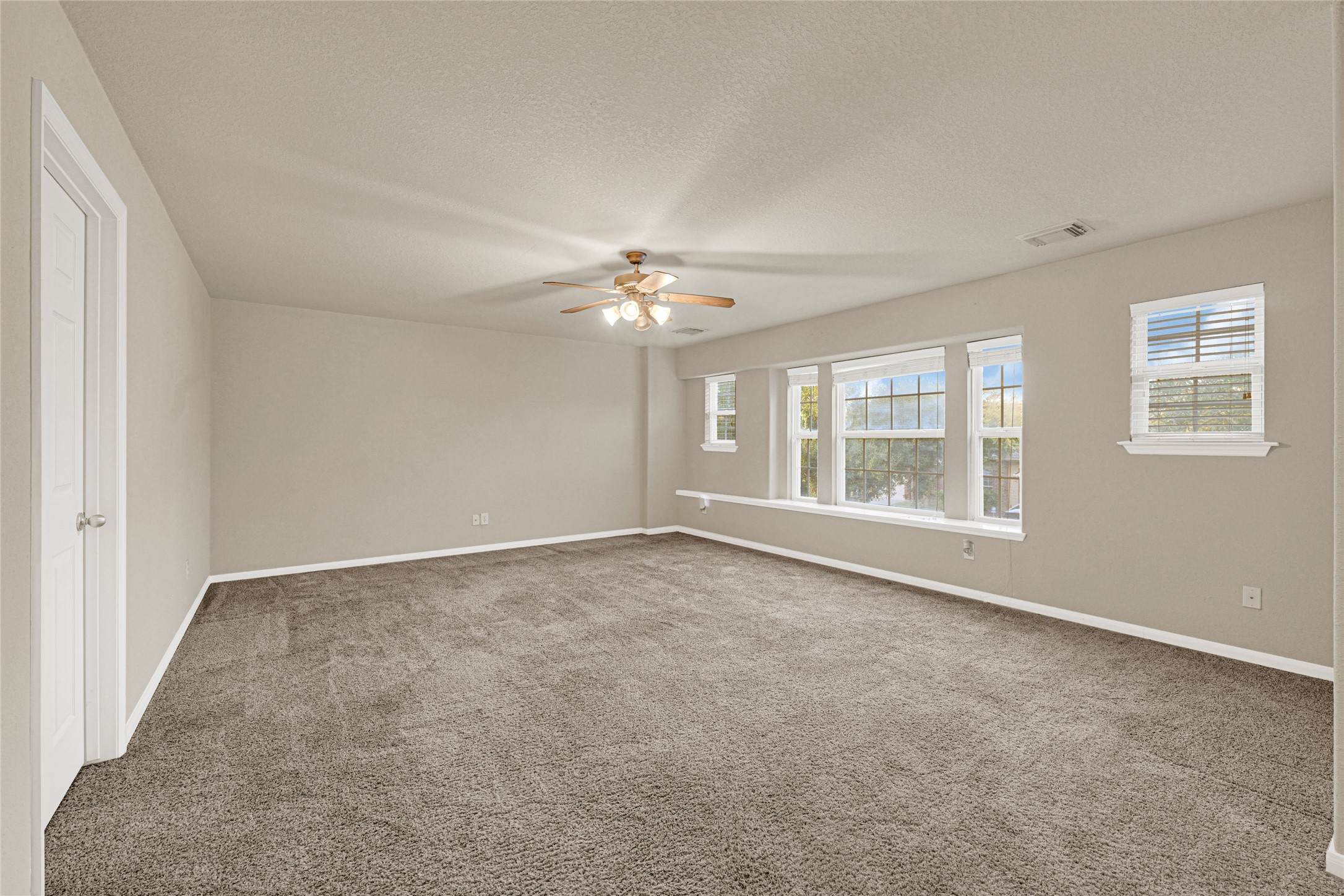 16415 Lapis River Drive Spring, TX 77379 - Photo 14 of 20 a view of an empty room with a window