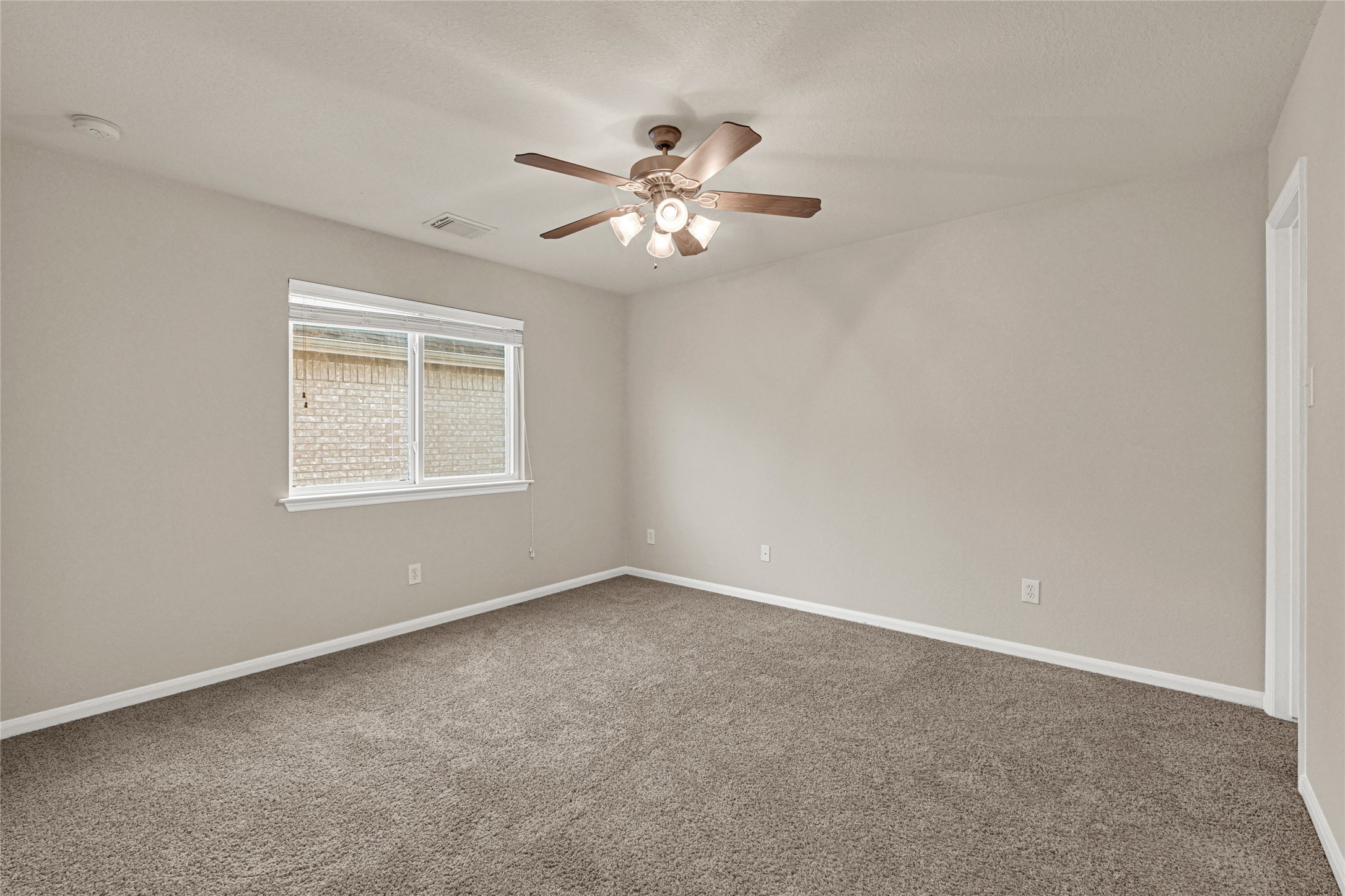 16415 Lapis River Drive Spring, TX 77379 - Photo 15 of 20 a view of an empty room with a window