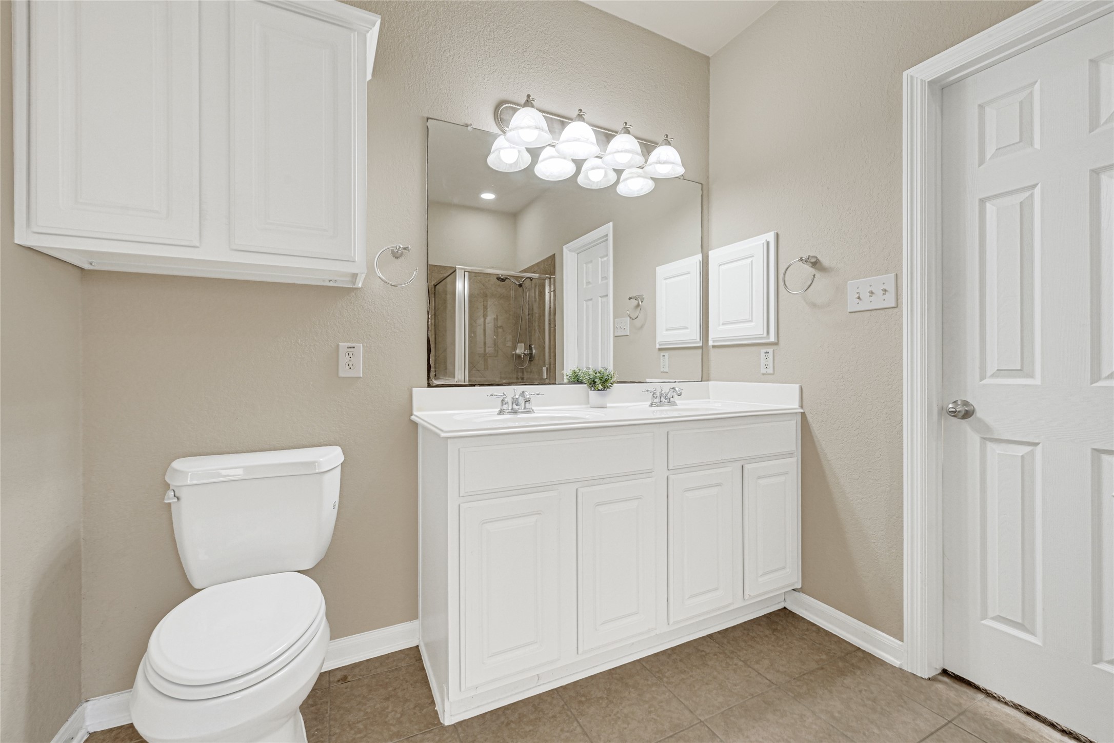 16415 Lapis River Drive Spring, TX 77379 - Photo 17 of 20 a bathroom with a toilet a sink and mirror