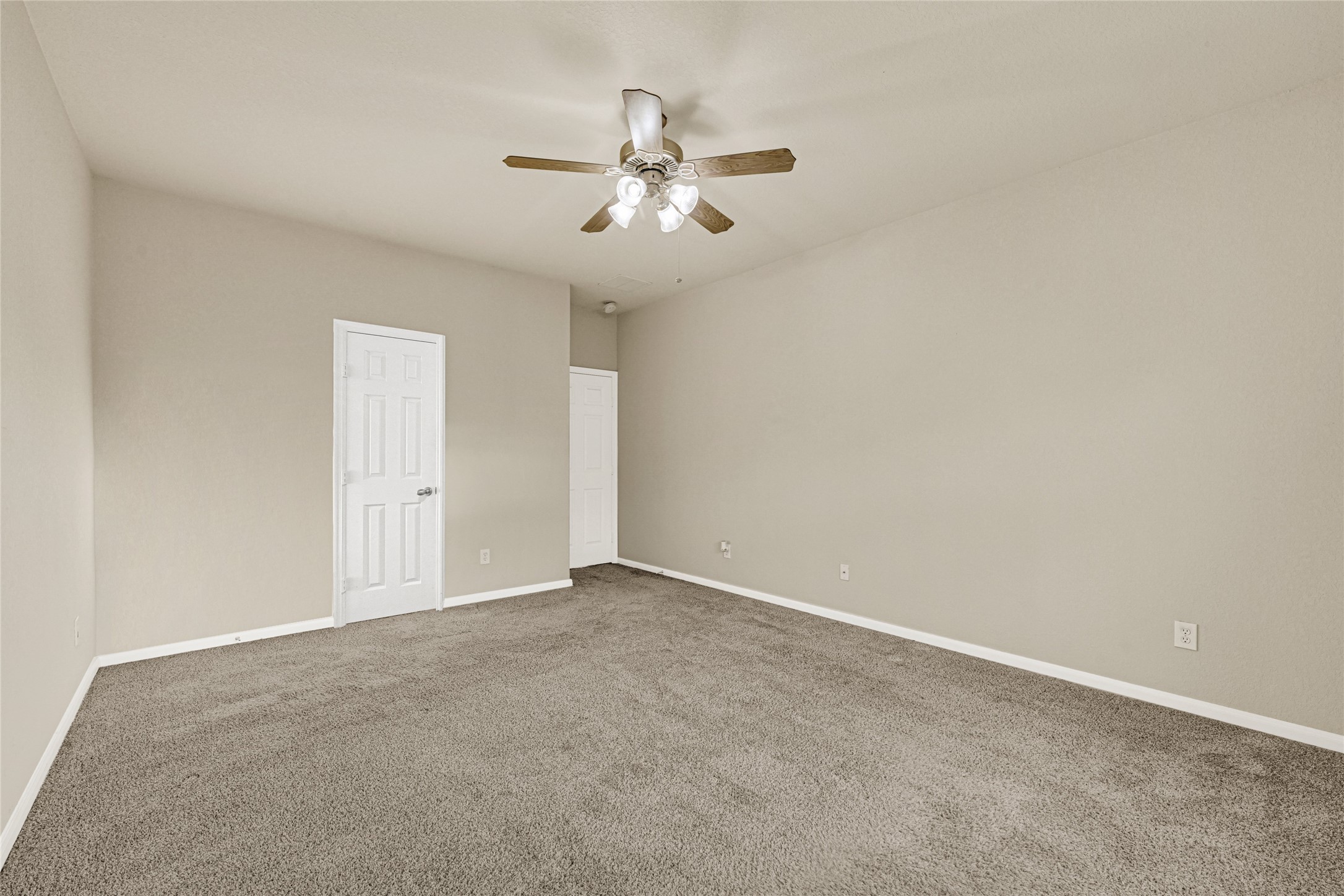 16415 Lapis River Drive Spring, TX 77379 - Photo 19 of 20 an empty room with chandelier fan and windows