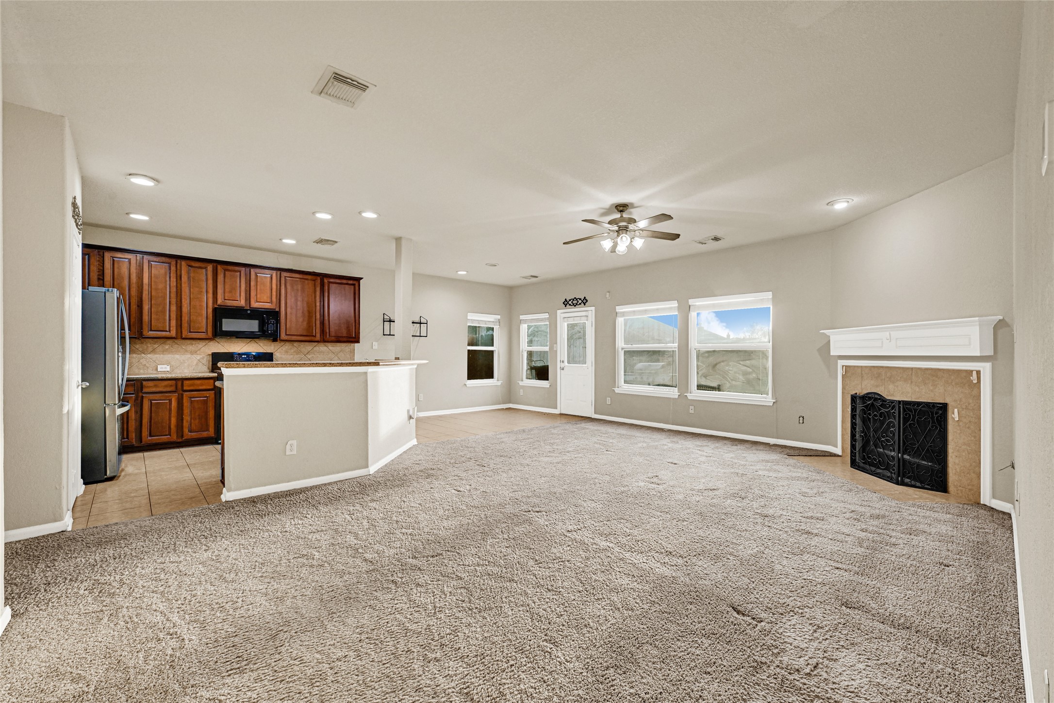 16415 Lapis River Drive Spring, TX 77379 - Photo 4 of 20 a view of a kitchen with a sink cabinets and a kitchen