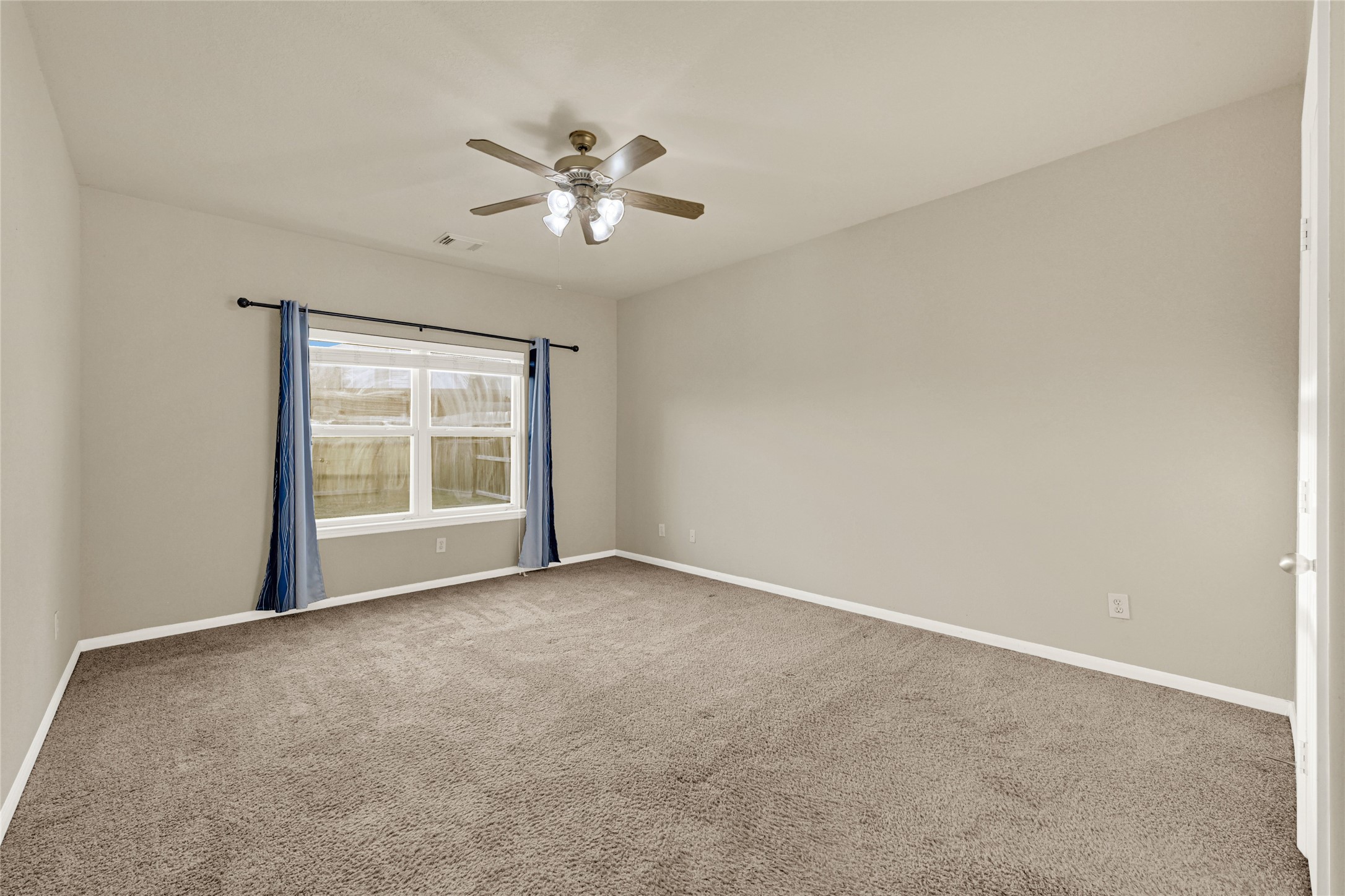 16415 Lapis River Drive Spring, TX 77379 - Photo 8 of 20 a view of an empty room with a window
