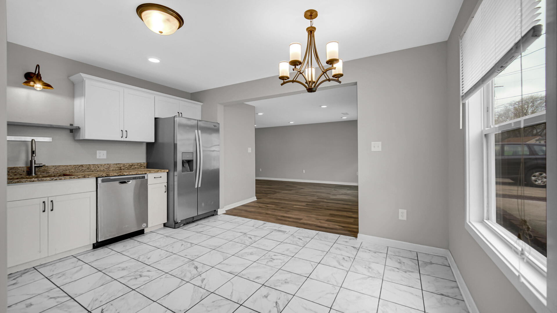 309 Michigami Trail Porter, IN 46304 - Photo 13 of 28 a kitchen with kitchen island granite countertop a refrigerator and a stove top oven