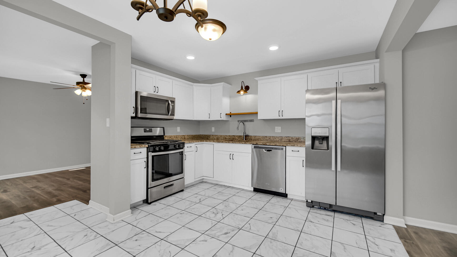 309 Michigami Trail Porter, IN 46304 - Photo 14 of 28 a kitchen with a refrigerator a microwave and cabinets