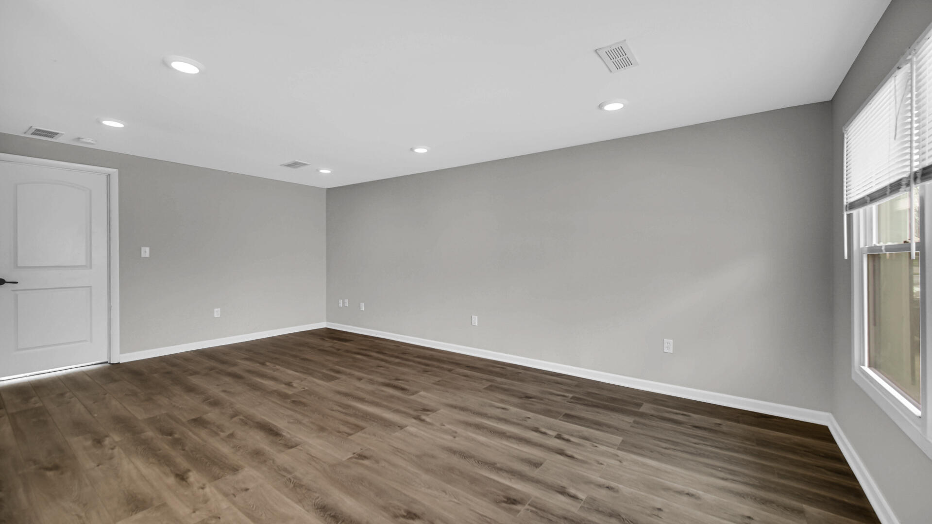 309 Michigami Trail Porter, IN 46304 - Photo 18 of 28 an empty room with wooden floor and windows