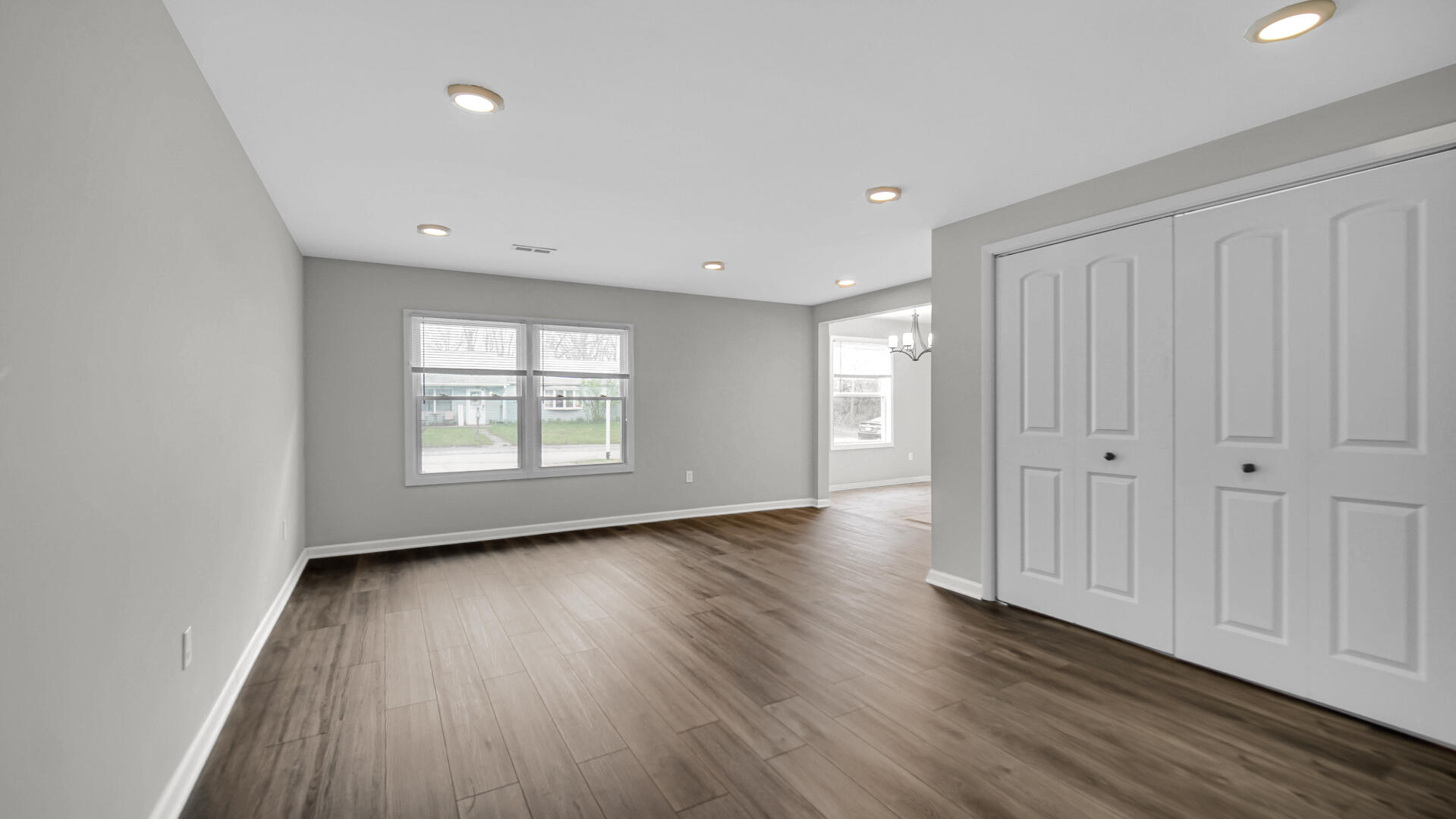 309 Michigami Trail Porter, IN 46304 - Photo 20 of 28 an empty room with wooden floor and windows