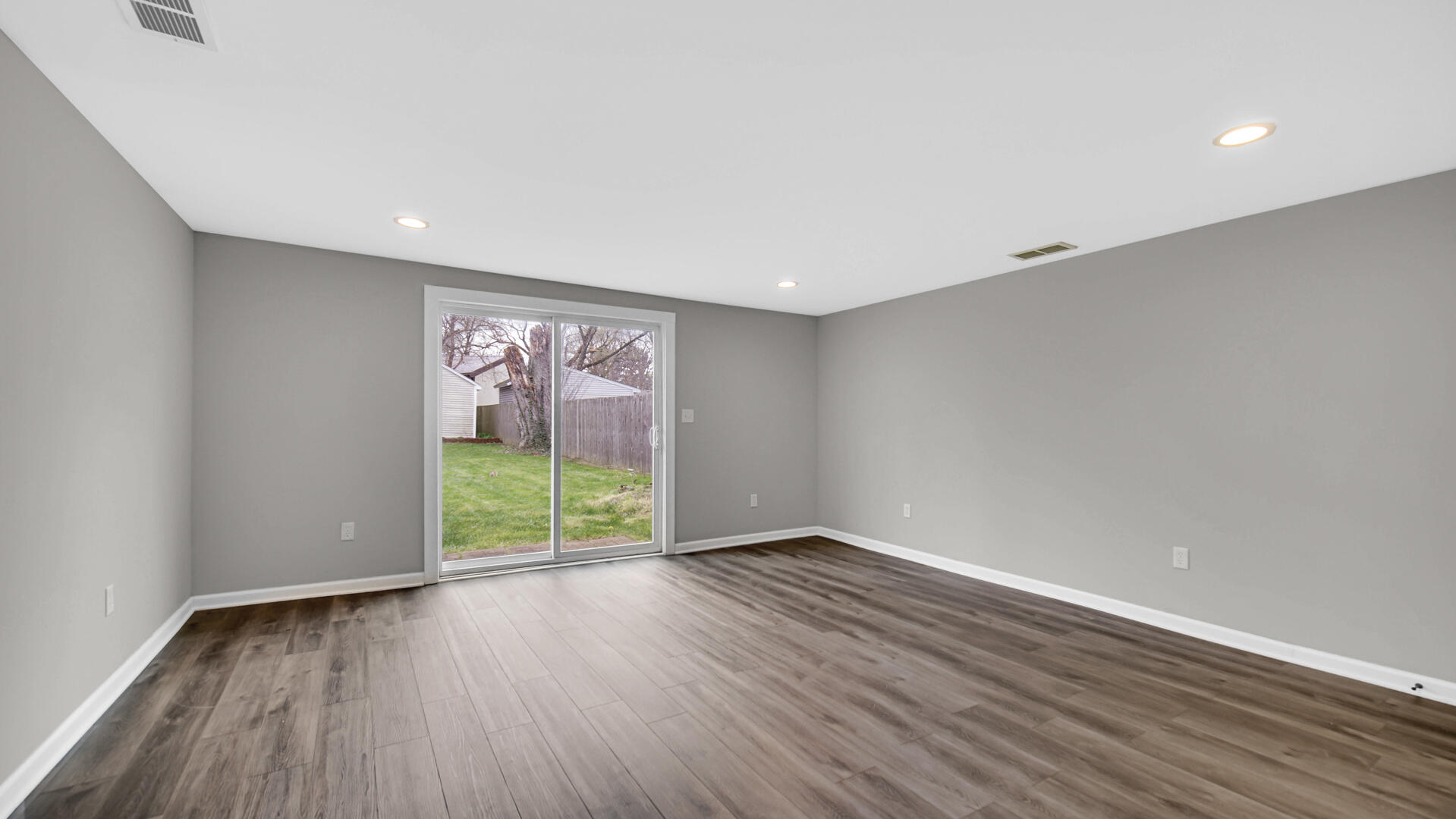 309 Michigami Trail Porter, IN 46304 - Photo 23 of 28 a view of an empty room with wooden floor and a window