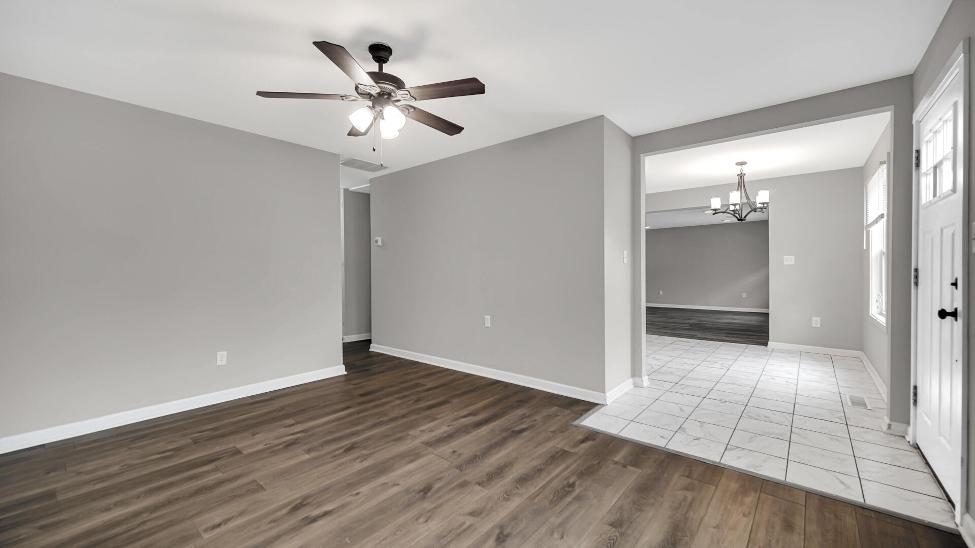 309 Michigami Trail Porter, IN 46304 - Photo 5 of 28 an empty room with wooden floor and ceiling fan