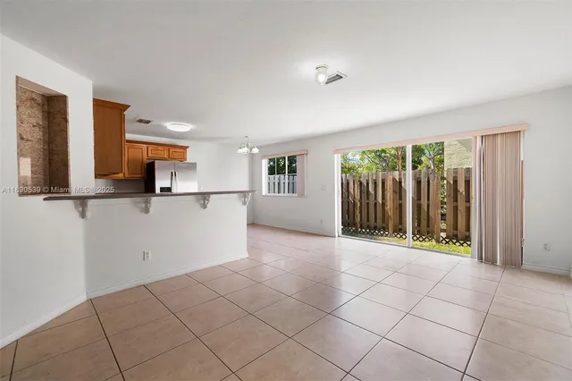 a view of a kitchen with a sink and cabinets