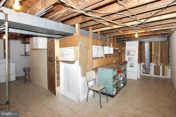 1005 Baltimore Road Rockville, MD 20851 - Photo 23 of 26 Unfinished Basement Storage w/Workbench