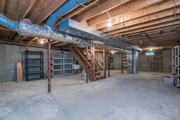 a view of empty room with wooden ceiling