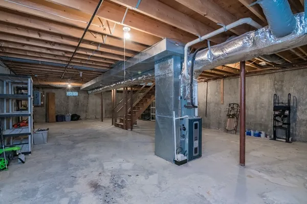 a view of empty room with wooden ceiling