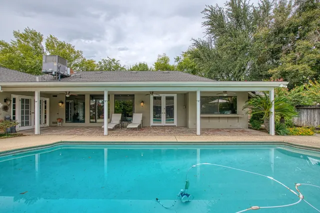 front view of a house with a swimming pool