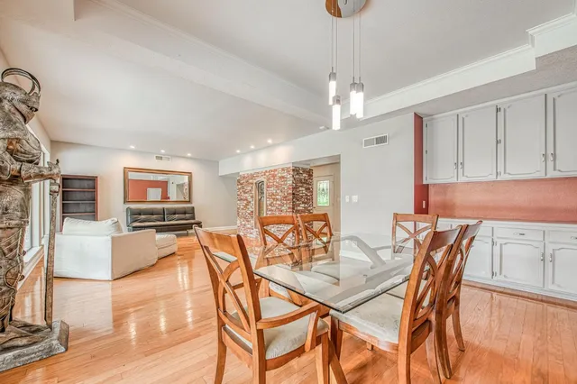 a view of a dining room with furniture window and outside view