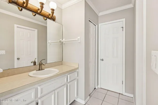 a bathroom with a sink double vanity and a mirror