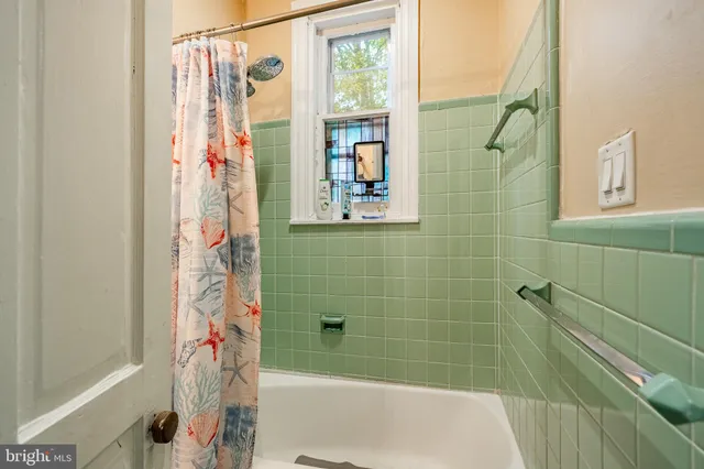 a bathroom with a shower and a bathtub