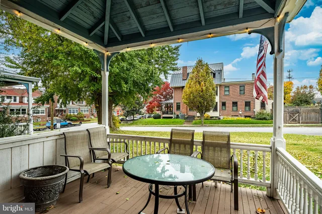 a view of a patio with a table chairs and a patio