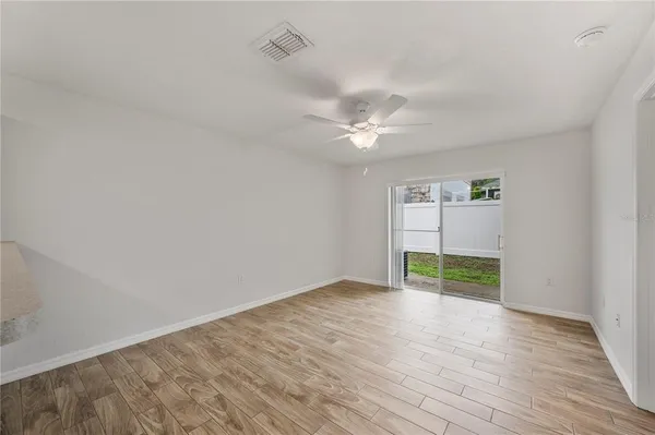 a bedroom with a bed and a potted plant