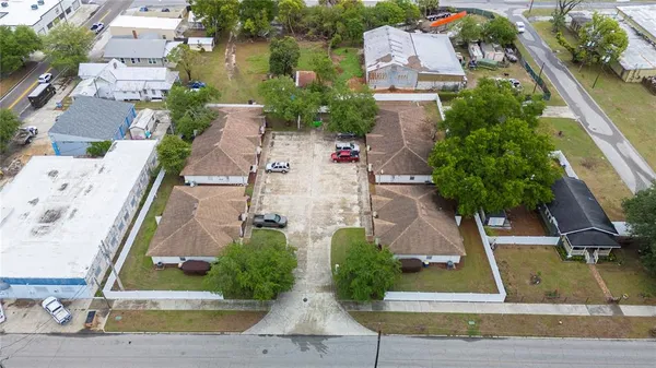 an aerial view of a house with yard and garden